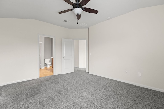 1105 Hawkeye Point Rd, Georgetown, TX 78626 - unfurnished bedroom featuring carpet, lofted ceiling, baseboards, connected bathroom, and a ceiling fan