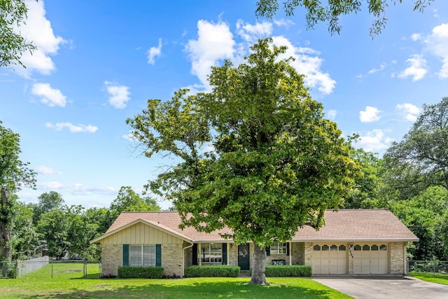 3503 Carla Dr, Austin, TX 78754 - view of front of home with brick siding, a garage, driveway, and a shingled roof