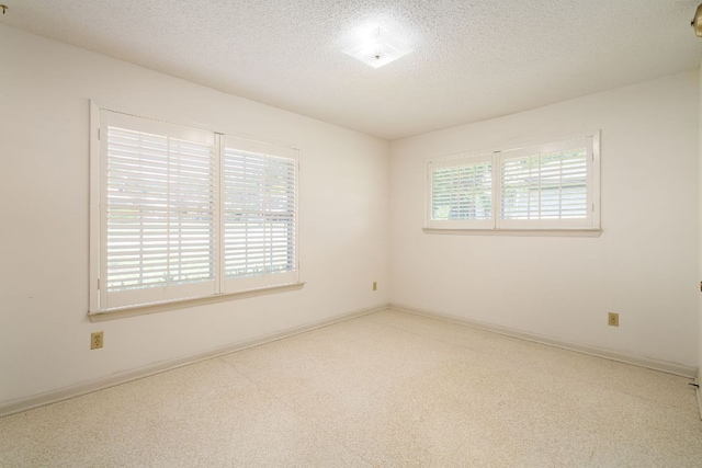 3503 Carla Dr, Austin, TX 78754 - empty room featuring carpet floors and a textured ceiling