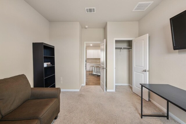 408 Rainmaker Ln, Bastrop, TX 78602 - sitting room featuring light carpet and baseboards