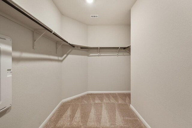 408 Rainmaker Ln, Bastrop, TX 78602 - walk in closet with carpet floors and a heating unit