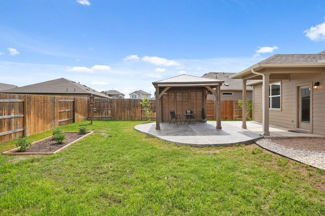 408 Rainmaker Ln, Bastrop, TX 78602 - view of yard featuring a gazebo, a patio, and a vegetable garden