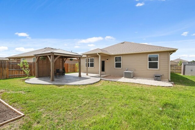 408 Rainmaker Ln, Bastrop, TX 78602 - rear view of property with a gazebo, a patio area, and central AC unit
