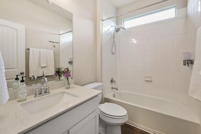 408 Rainmaker Ln, Bastrop, TX 78602 - bathroom featuring toilet, vanity, and shower / tub combination