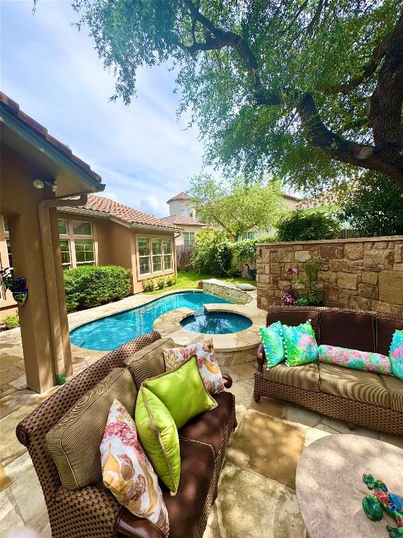 8212 Denali Pkwy, Austin, TX 78726 - view of swimming pool with outdoor lounge area, a patio area, and a pool with connected hot tub