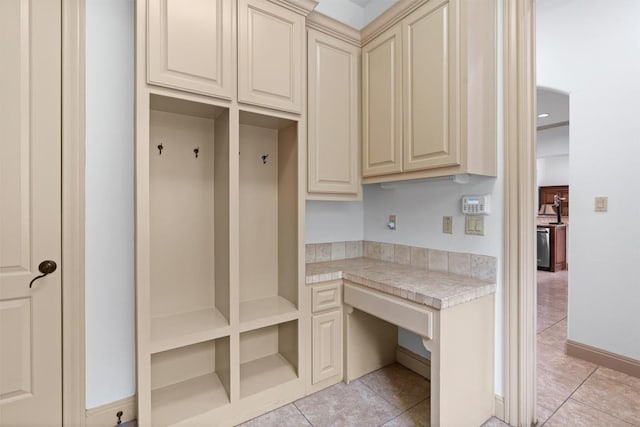 8212 Denali Pkwy, Austin, TX 78726 - mudroom with built in study area and light tile patterned flooring