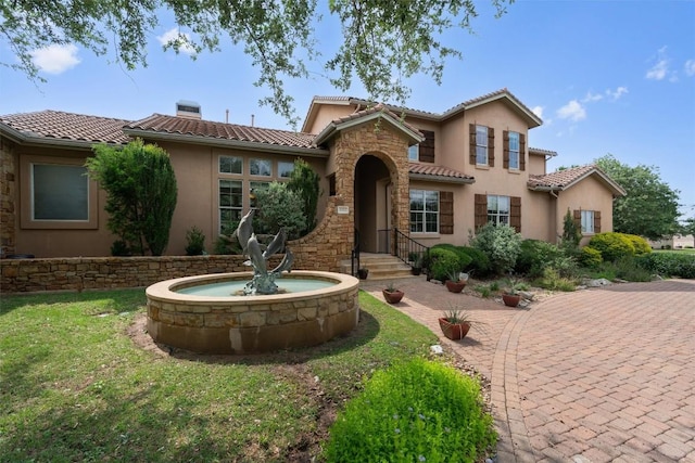 8212 Denali Pkwy, Austin, TX 78726 - mediterranean / spanish house featuring stucco siding, a tile roof, a chimney, and a front yard