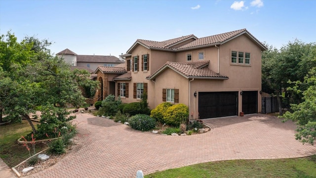 8212 Denali Pkwy, Austin, TX 78726 - mediterranean / spanish-style home featuring a garage, a tiled roof, stucco siding, and decorative driveway