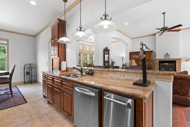 8212 Denali Pkwy, Austin, TX 78726 - kitchen with stainless steel dishwasher, open floor plan, crown molding, light stone counters, and pendant lighting