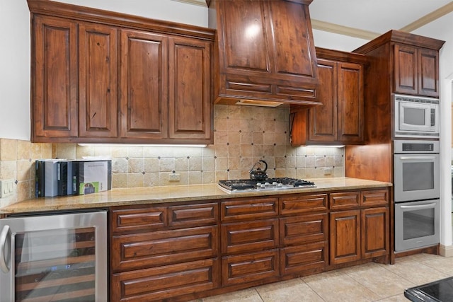 8212 Denali Pkwy, Austin, TX 78726 - kitchen featuring beverage cooler, appliances with stainless steel finishes, backsplash, and custom exhaust hood