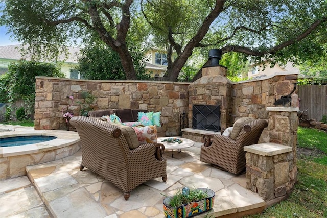 8212 Denali Pkwy, Austin, TX 78726 - view of patio with an in-ground hot tub and an outdoor living space with a fireplace