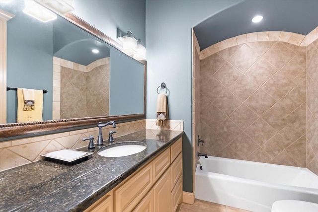 8212 Denali Pkwy, Austin, TX 78726 - bathroom with vanity, tile patterned flooring,  shower combination, and decorative backsplash