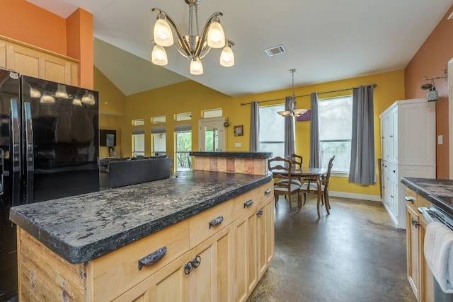 1608 Susan Dr, Austin, TX 78734 - kitchen with a chandelier, freestanding refrigerator, concrete flooring, baseboards, and a kitchen island