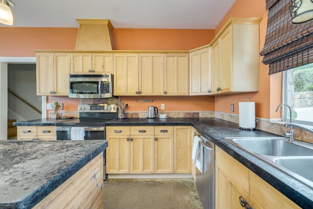 1608 Susan Dr, Austin, TX 78734 - kitchen featuring appliances with stainless steel finishes, light brown cabinets, and a sink