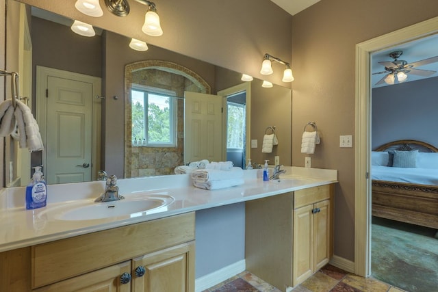 1608 Susan Dr, Austin, TX 78734 - ensuite bathroom with double vanity, a ceiling fan, and baseboards