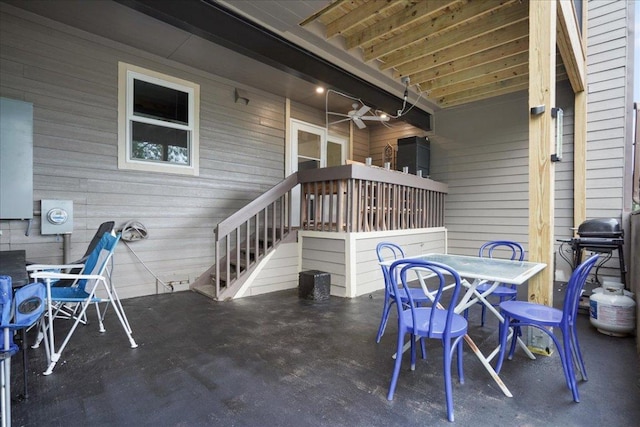 551 Demarett Dr Unit 4, Point Venture, TX 78645 - view of patio featuring outdoor dining area, a ceiling fan, and a grill