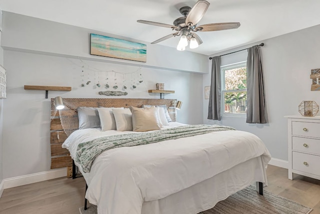 551 Demarett Dr Unit 4, Point Venture, TX 78645 - bedroom featuring baseboards, wood finished floors, and a ceiling fan