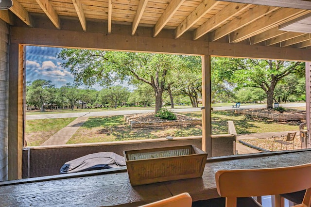551 Demarett Dr Unit 4, Point Venture, TX 78645 - sunroom featuring view of scattered trees and healthy amount of natural light