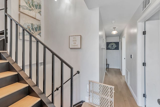 551 Demarett Dr Unit 4, Point Venture, TX 78645 - stairs with wood finished floors and baseboards