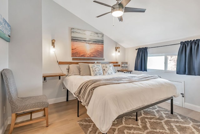 551 Demarett Dr Unit 4, Point Venture, TX 78645 - bedroom featuring light wood-style flooring, vaulted ceiling, baseboards, and a ceiling fan