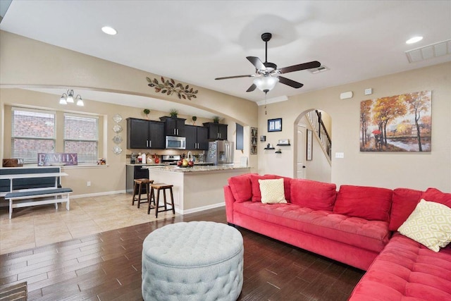 5627 Sabbia Dr, Round Rock, TX 78665 - living area with ceiling fan, wood finished floors, recessed lighting, and arched walkways