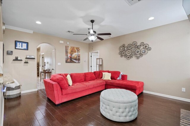 5627 Sabbia Dr, Round Rock, TX 78665 - living area featuring arched walkways, a ceiling fan, dark wood-style floors, and recessed lighting