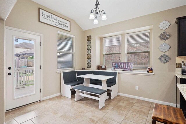 5627 Sabbia Dr, Round Rock, TX 78665 - dining area with healthy amount of natural light, vaulted ceiling, and a chandelier