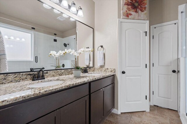 5627 Sabbia Dr, Round Rock, TX 78665 - full bath featuring double vanity and a shower stall