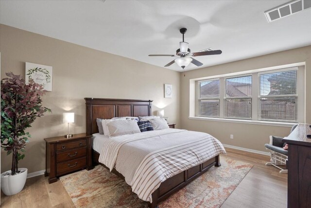5627 Sabbia Dr, Round Rock, TX 78665 - bedroom featuring light wood-type flooring and ceiling fan
