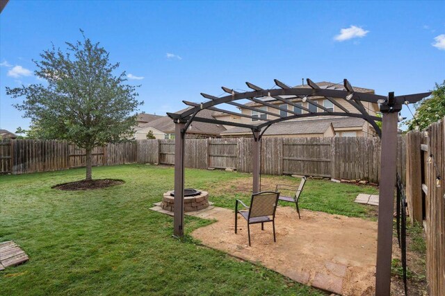 5627 Sabbia Dr, Round Rock, TX 78665 - fenced backyard with an outdoor fire pit, a pergola, and a patio area