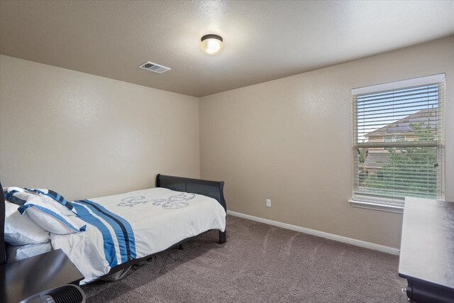 5627 Sabbia Dr, Round Rock, TX 78665 - carpeted bedroom featuring baseboards
