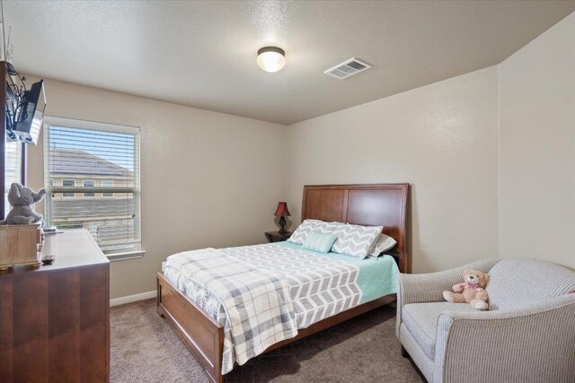 5627 Sabbia Dr, Round Rock, TX 78665 - bedroom featuring light carpet and baseboards