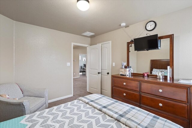 5627 Sabbia Dr, Round Rock, TX 78665 - bedroom with carpet flooring and baseboards