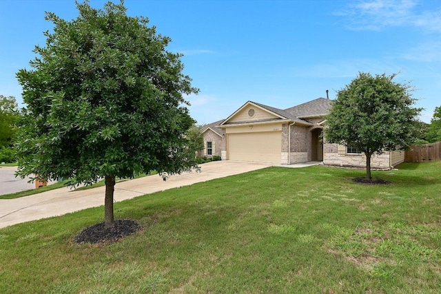 10204 Tildon Ave, Austin, TX 78754 - obstructed view of property with driveway, an attached garage, stone siding, and brick siding