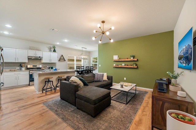 10204 Tildon Ave, Austin, TX 78754 - living area featuring a chandelier, light wood finished floors, and recessed lighting