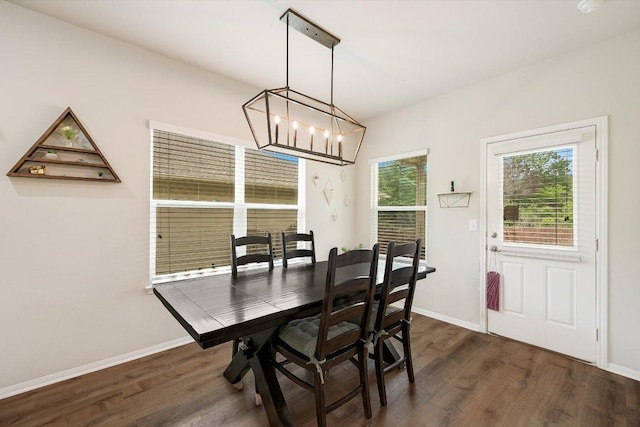 10204 Tildon Ave, Austin, TX 78754 - dining room featuring a chandelier and dark wood-style flooring
