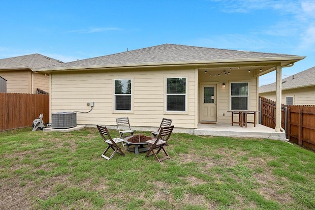 10204 Tildon Ave, Austin, TX 78754 - back of property with an outdoor fire pit, a patio, and central AC