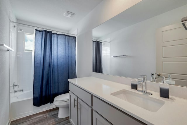 13901 Zuhause Dr, Pflugerville, TX 78660 - full bath with toilet, vanity, shower / tub combo, and wood finished floors