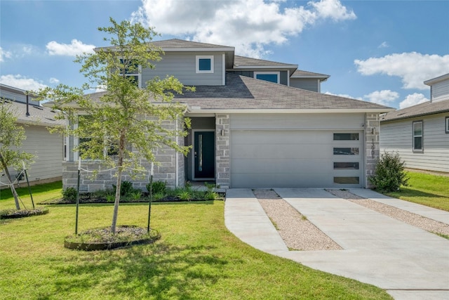 13901 Zuhause Dr, Pflugerville, TX 78660 - view of front of house featuring driveway, stone siding, an attached garage, and a front yard