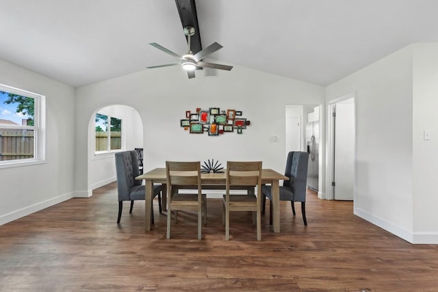 10802 Thicket Trl, Austin, TX 78750 - dining room with lofted ceiling, a ceiling fan, arched walkways, baseboards, and dark wood-style flooring