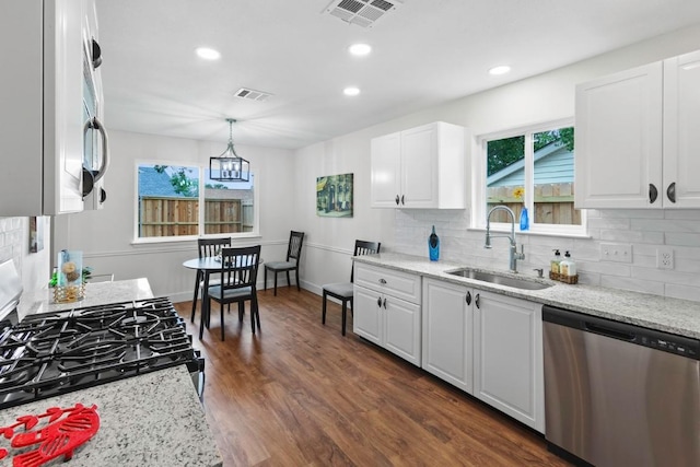 10802 Thicket Trl, Austin, TX 78750 - kitchen with stainless steel dishwasher, a sink, range with gas stovetop, tasteful backsplash, and recessed lighting
