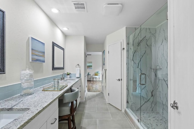 10802 Thicket Trl, Austin, TX 78750 - full bathroom featuring a marble finish shower, vanity, tile patterned floors, and recessed lighting