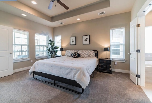 4301 Mansfield Dam Rd Unit 1102, Austin, TX 78734 - carpeted bedroom with multiple windows, baseboards, recessed lighting, a tray ceiling, and ceiling fan