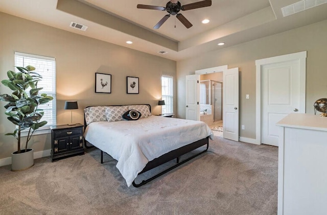 4301 Mansfield Dam Rd Unit 1102, Austin, TX 78734 - bedroom with light colored carpet, a raised ceiling, recessed lighting, baseboards, and connected bathroom