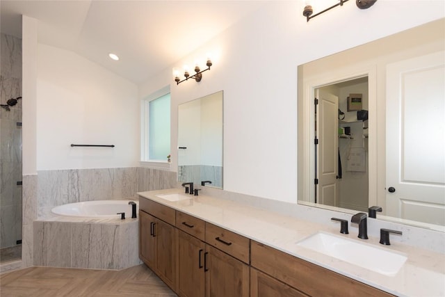 121 Split Oak Dr, Cedar Park, TX 78613 - bathroom featuring a garden tub, a marble finish shower, double vanity, vaulted ceiling, and recessed lighting