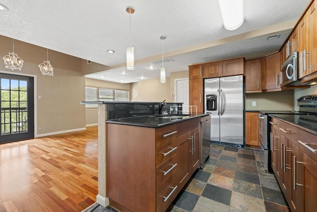 8888 Tallwood Dr Unit 1301, Austin, TX 78759 - kitchen featuring stainless steel appliances, a sink, baseboards, healthy amount of natural light, and recessed lighting