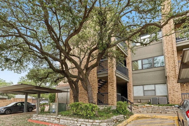 8888 Tallwood Dr Unit 1301, Austin, TX 78759 - view of building exterior with central air condition unit