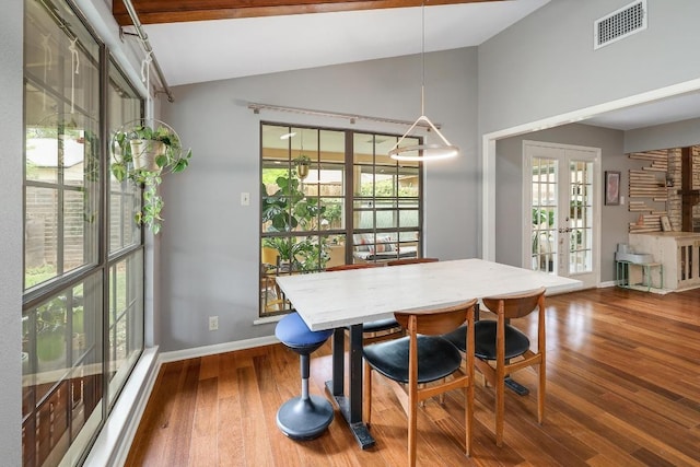 8701 Millway Dr, Austin, TX 78757 - dining area with vaulted ceiling, french doors, wood finished floors, and baseboards