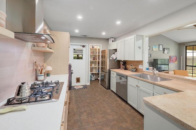 8701 Millway Dr, Austin, TX 78757 - kitchen featuring appliances with stainless steel finishes, ventilation hood, a sink, tasteful backsplash, and recessed lighting
