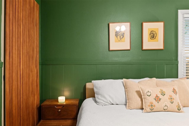 109 W 55th 1/2 St, Austin, TX 78751 - bedroom featuring a decorative wall and wainscoting